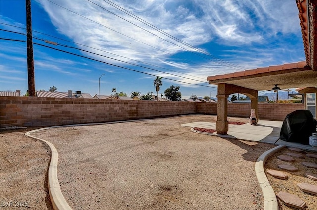 view of yard featuring a patio and a fenced backyard