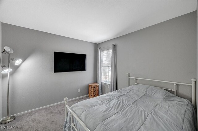 bedroom featuring baseboards and carpet flooring