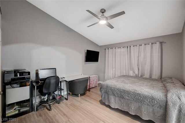 bedroom featuring baseboards, wood finished floors, ceiling fan, and vaulted ceiling