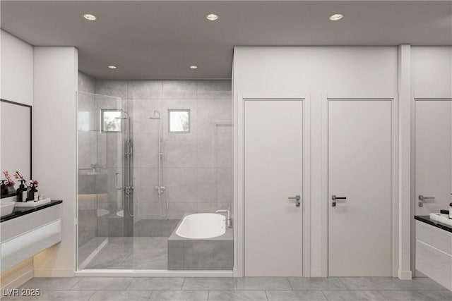 full bathroom featuring a bathtub, recessed lighting, a shower stall, and vanity