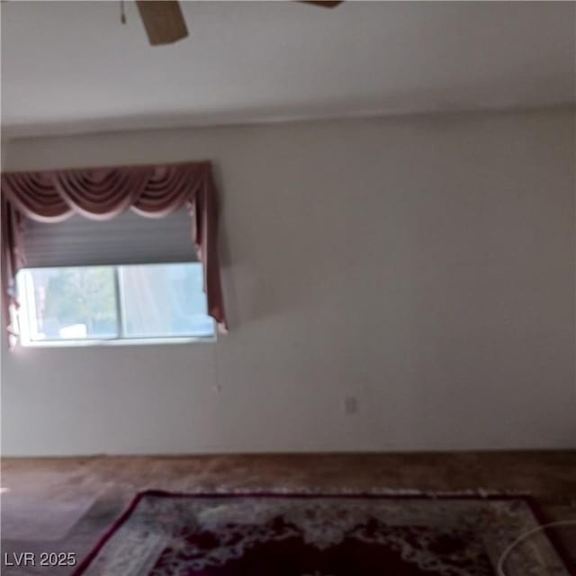 spare room featuring a ceiling fan