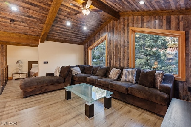 living room with lofted ceiling with beams, wood finished floors, wooden ceiling, and a ceiling fan