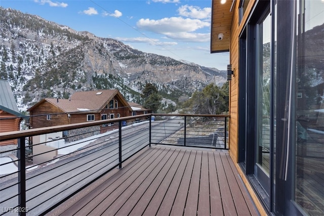 wooden deck featuring a mountain view