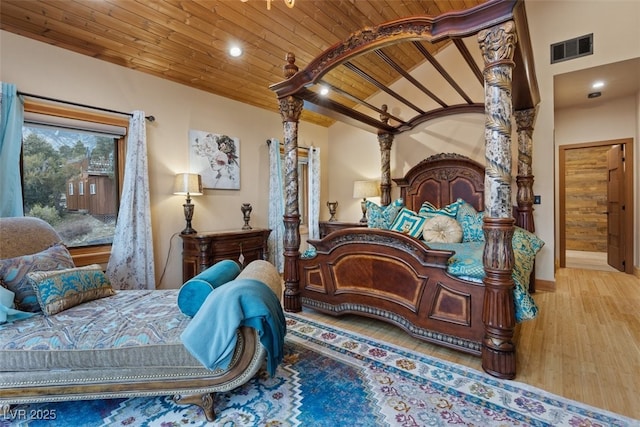 bedroom with wood finished floors, visible vents, recessed lighting, vaulted ceiling, and wood ceiling