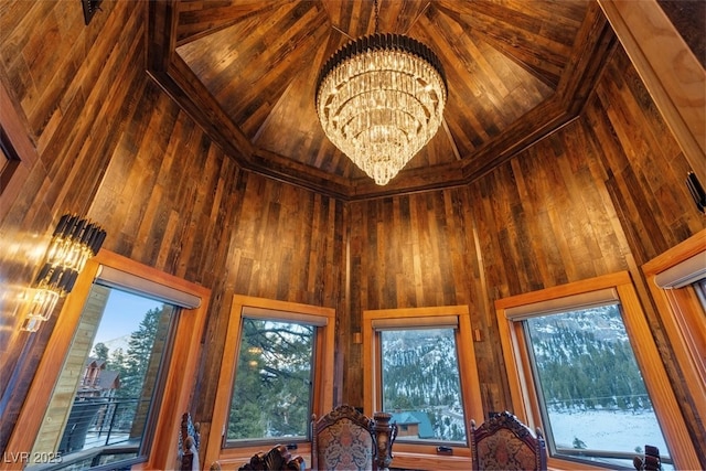 details with a notable chandelier and wood walls