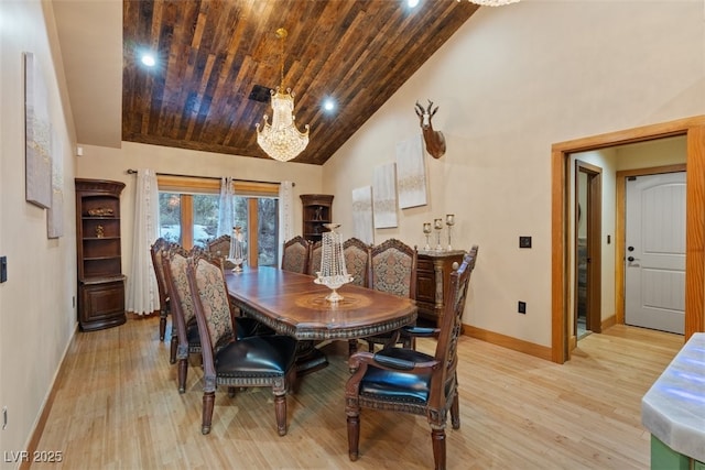 dining space with wooden ceiling, baseboards, light wood-type flooring, and high vaulted ceiling