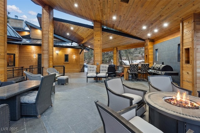 view of patio featuring a fire pit and a grill