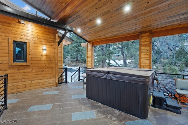 view of patio / terrace with a hot tub