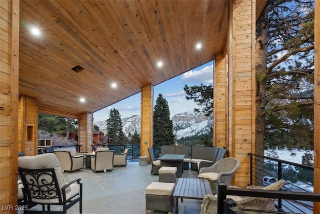 view of patio / terrace with a mountain view and outdoor lounge area