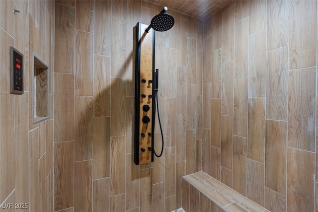 bathroom with tiled shower