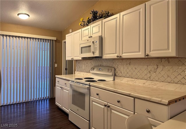 kitchen with white cabinetry, white appliances, dark wood-style floors, and light countertops