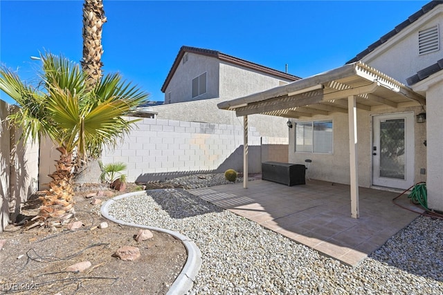 view of patio featuring a pergola and a fenced backyard