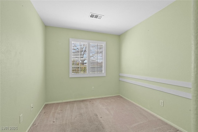 unfurnished room featuring visible vents, baseboards, and carpet flooring