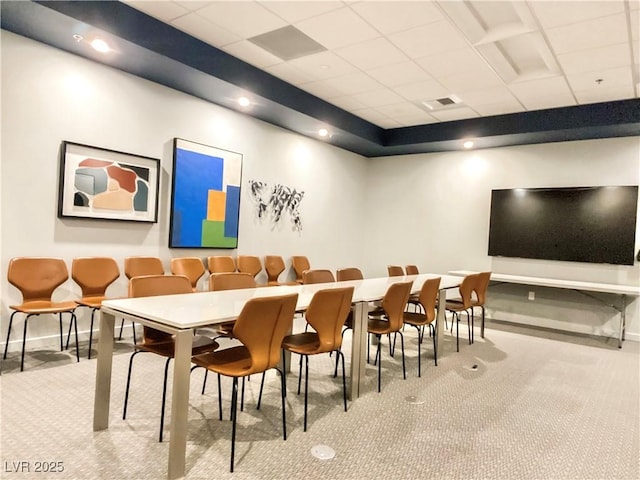 dining room with visible vents, baseboards, carpet, and a drop ceiling