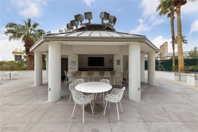 view of patio featuring a gazebo and outdoor dry bar