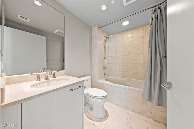 bathroom with visible vents, vanity, toilet, and shower / bath combo with shower curtain