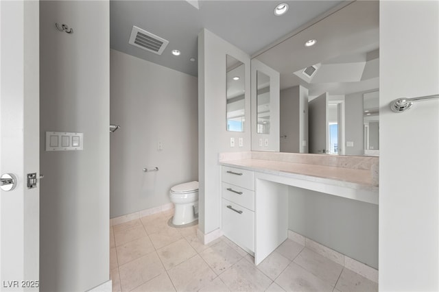 bathroom with visible vents, toilet, vanity, and tile patterned flooring