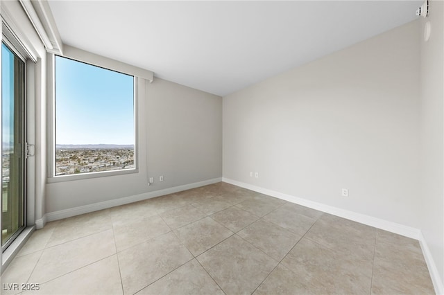 tiled empty room with baseboards