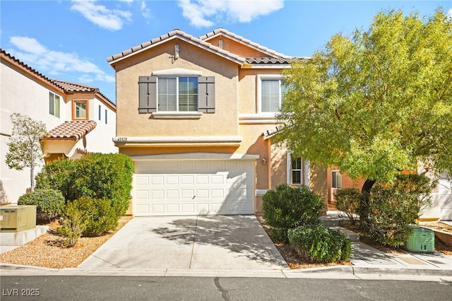 view of front of house with a tiled roof, an attached garage, driveway, and stucco siding