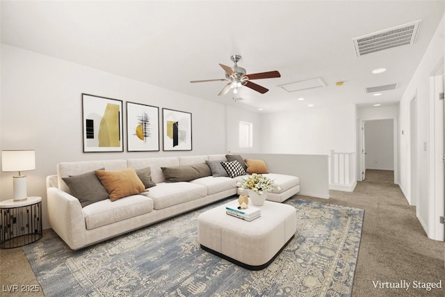 carpeted living area featuring recessed lighting, visible vents, baseboards, and attic access