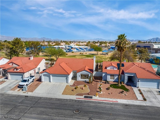 aerial view with a mountain view and a residential view