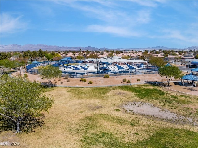 birds eye view of property with a mountain view