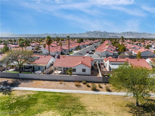 birds eye view of property with a residential view and a mountain view