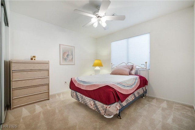 bedroom with ceiling fan and carpet floors