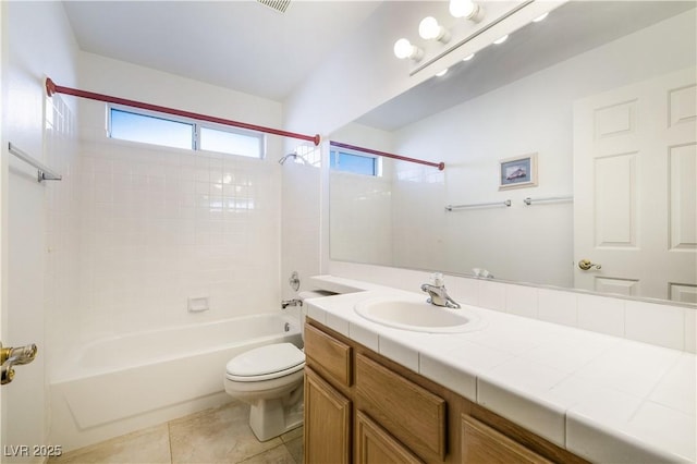 full bathroom with tile patterned floors, toilet, vanity, and bathtub / shower combination