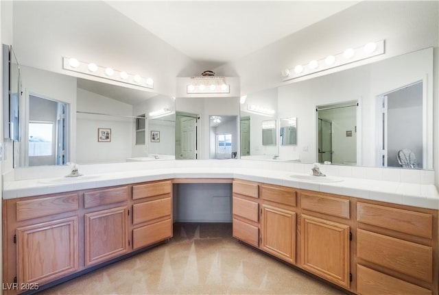 bathroom with an enclosed shower and vanity