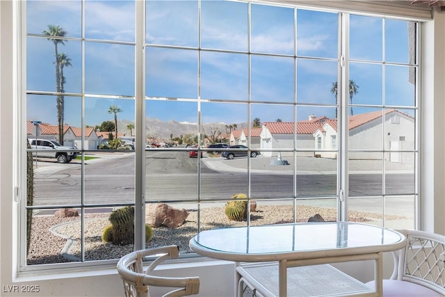 interior space with a wealth of natural light and a residential view