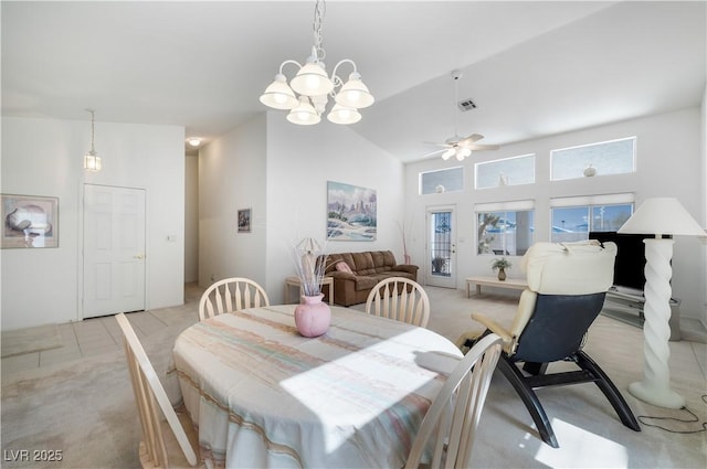 dining area with light colored carpet, visible vents, and a wealth of natural light