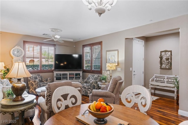 dining area with visible vents, baseboards, ceiling fan, and wood finished floors