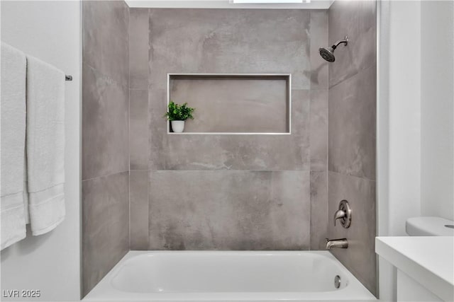 full bath with vanity,  shower combination, and toilet