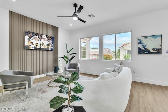 living room featuring wood finished floors, visible vents, baseboards, recessed lighting, and ceiling fan