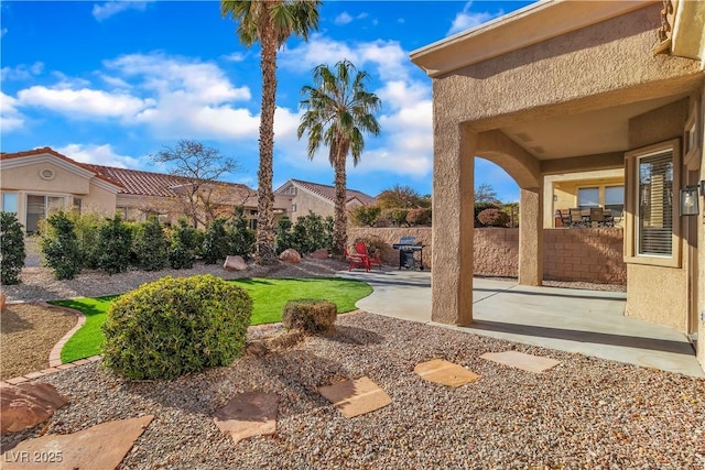 view of yard featuring a patio and fence