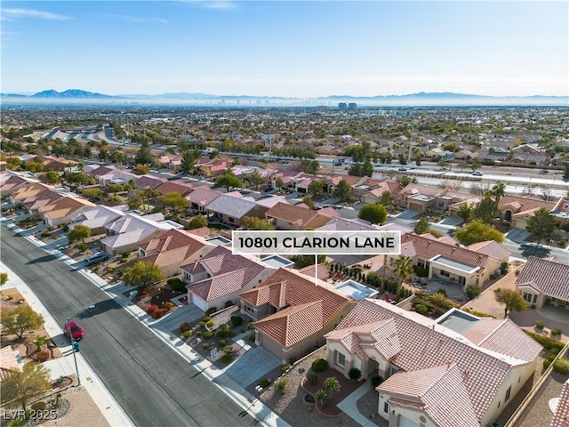 birds eye view of property with a mountain view and a residential view