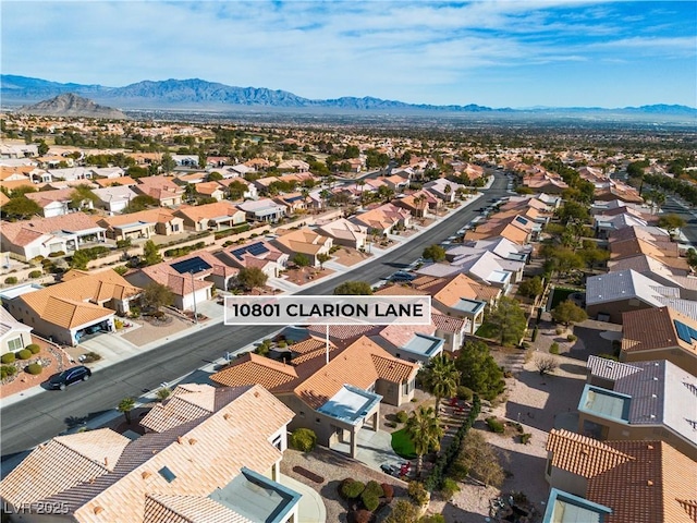 aerial view with a mountain view and a residential view