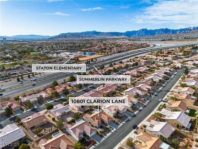 drone / aerial view featuring a mountain view and a residential view