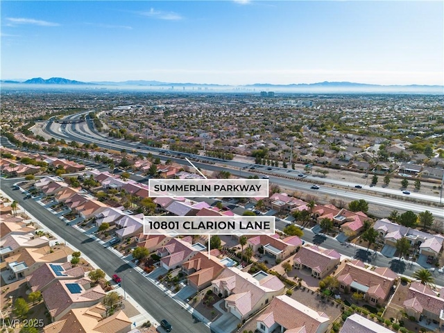 birds eye view of property featuring a mountain view and a residential view