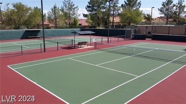 view of sport court featuring community basketball court and fence