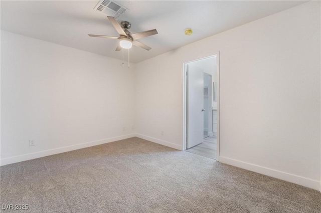 empty room featuring ceiling fan, baseboards, visible vents, and light carpet