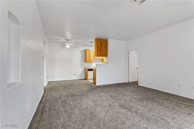 unfurnished living room featuring visible vents, baseboards, a ceiling fan, and carpet flooring