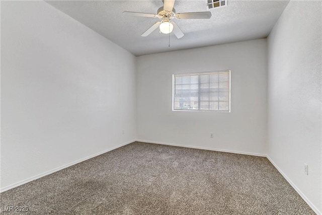 carpeted empty room featuring visible vents, baseboards, a textured ceiling, and ceiling fan