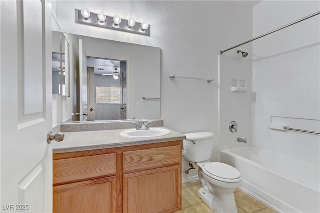 full bathroom featuring toilet, bathing tub / shower combination, tile patterned floors, vanity, and a ceiling fan