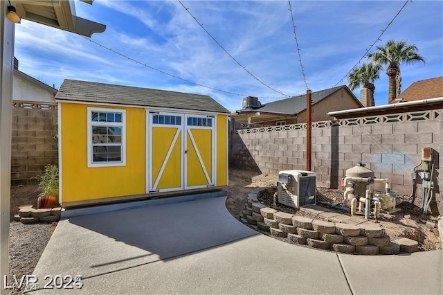 view of shed with a fenced backyard