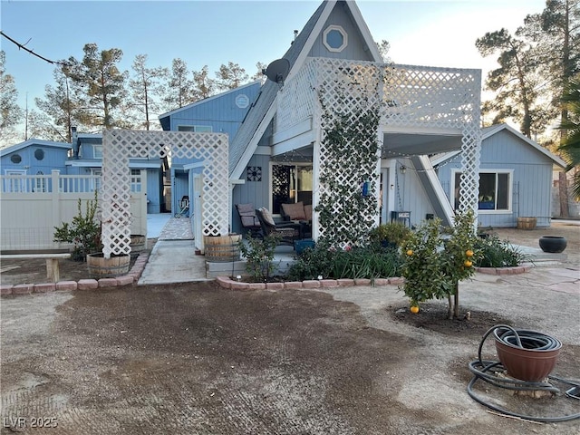 view of front of home featuring fence