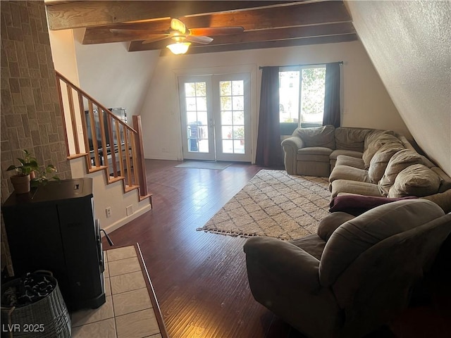 living area with ceiling fan, stairway, lofted ceiling with beams, french doors, and wood finished floors