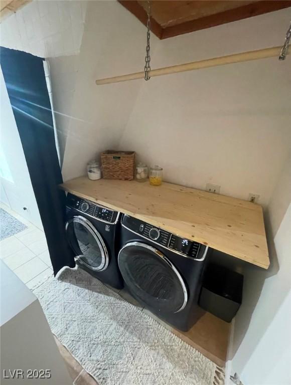 laundry room with independent washer and dryer