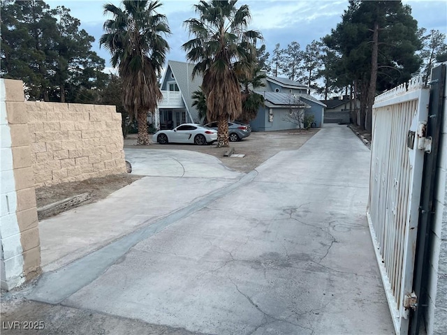 view of street featuring concrete driveway